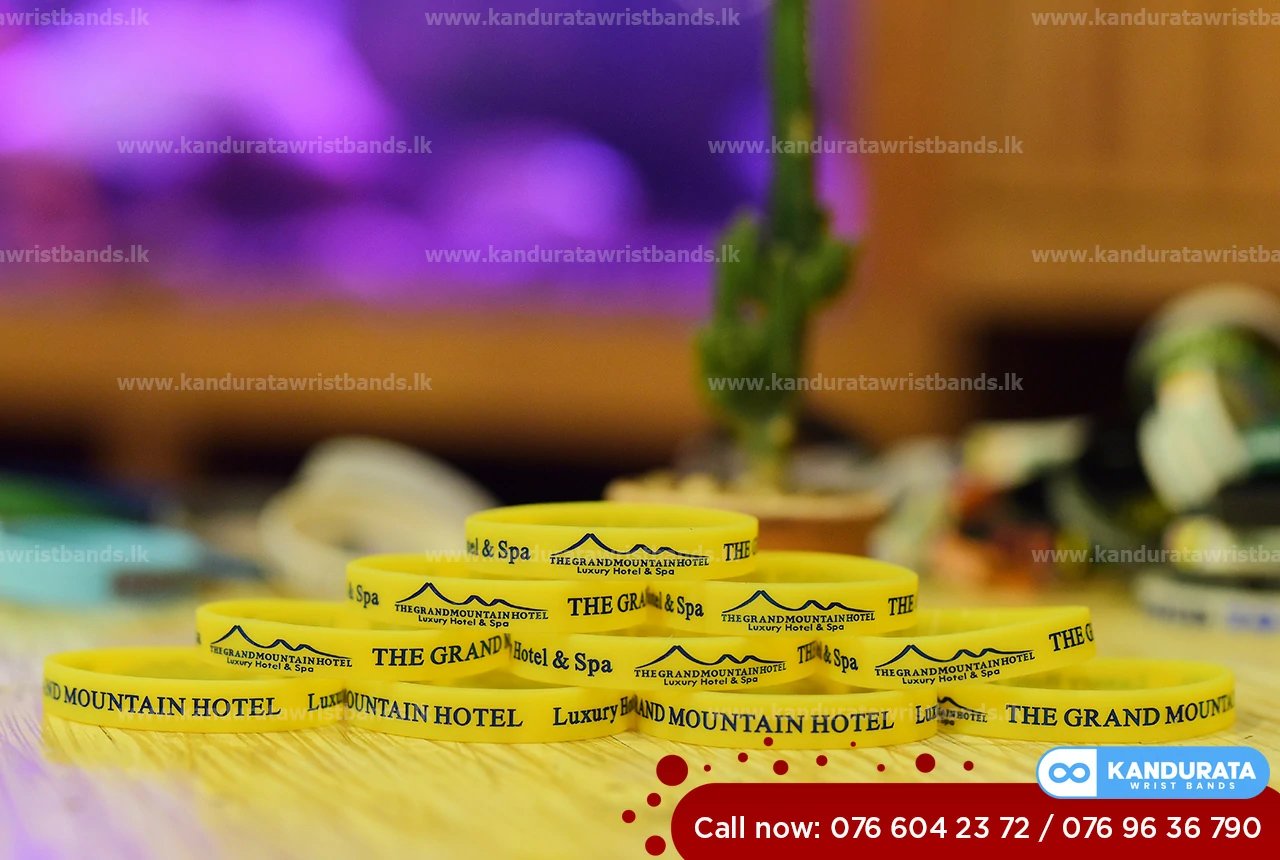 yellow Debossed and ink filled bracelets/wristband for THE GRAND MOUNTAIN HOTEL sri Lanka